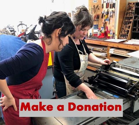 Make a Donation - two women working on the letterpress